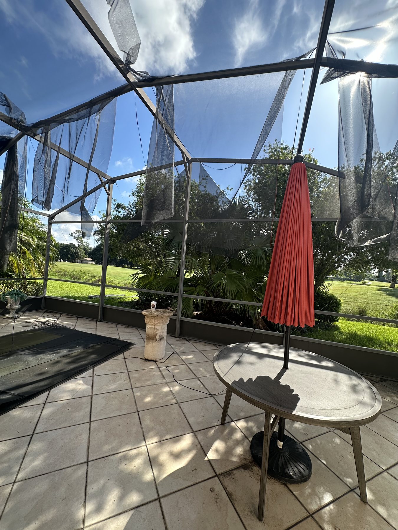 Pool enclosure being prepared for screen repair